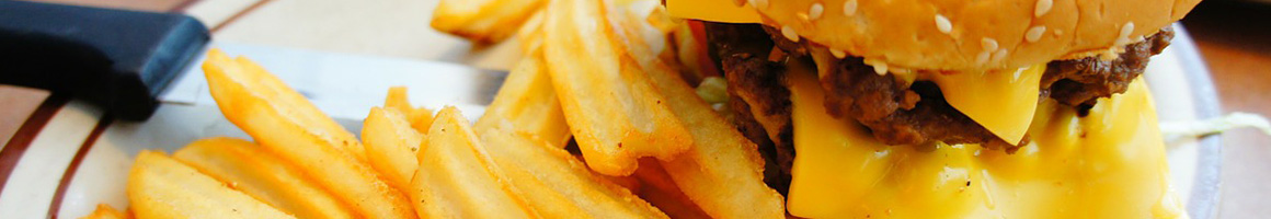 Eating American (Traditional) Burger at PJ Clarke’s DC restaurant in Washington, DC.